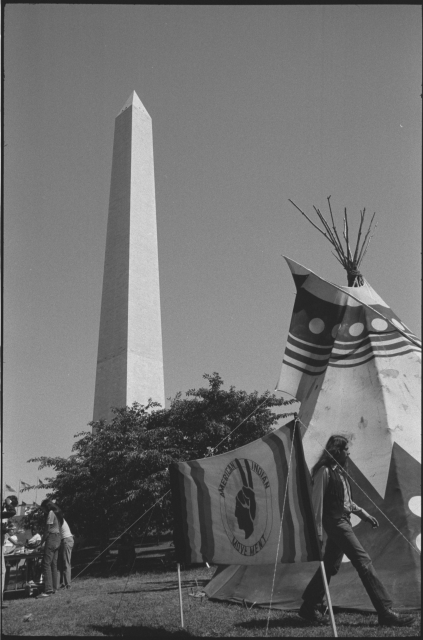 Tipi and AIM sign on the grounds of the Washington Monument