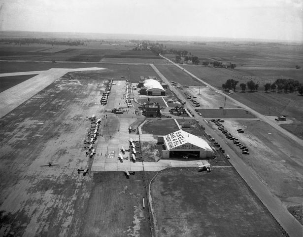 Black and white photograph of Northwest Airlines and McInnis Aviation Service hangars, Wold-Chamberlain Field, undated.