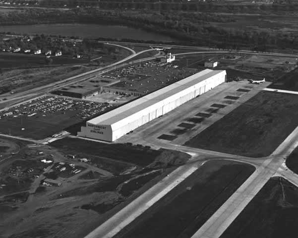 Black and white photograph of Northwest Orient Airlines hangar and offices at the Minneapolis-St. Paul International Airport, c.1960. Photographed by Marty Nordstrom Photography.
