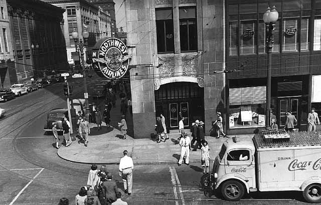 Black and white photograph of a Northwest Airlines city ticket office, 100 Sixth Street South, Minneapolis, c.1950. 