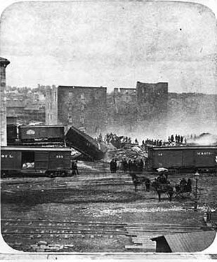 Black and white photograph of the ruins of the Pettit, Zenith, and Galaxy Mills after Washburn A Mill explosion on the Mississippi Riverfront, 1878.