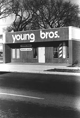 Young Brothers Barber Shop and Satin Doll Beauty Salon, 1918 Plymouth Avenue North, Minneapolis, ca. 1970s. The Young brothers owned multiple barber shops on Plymouth Avenue North.