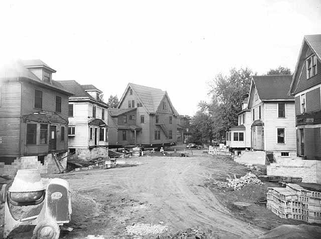 Black and white photograph of Houses being moved, undated.