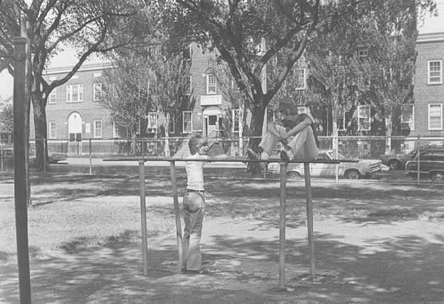 Black and white photograph of children in front of the Northeast Neighborhood House, 1976.