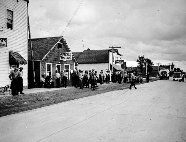 Striking lumberjacks standing near strike headquarters, Marenisco, Michigan.