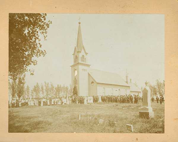 Congregation standing outside Swedish Lutheran Church in Svea Township 
