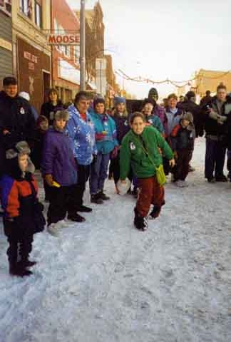 Color image of Delia Levine-Horrigan getting ready to bowl in Turkey Bowling at Ice Box Days, International Falls, 1999.