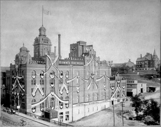 A view of Hamm’s Brewery in St. Paul, designed by August Maritzen, ca. 1905. The ornamental design of the building was later removed as the facilities were updated for operations. The large house on the bluff near the brewery was built for Theodore Hamm and his wife, Louise.