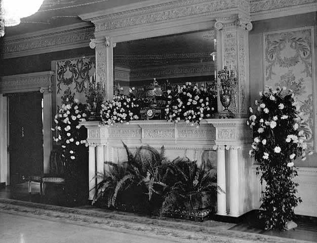 Black and white photograph of a drawing room decorated for Charlotte Hill's wedding to George T. Slade at the James J. Hill house, 240 Summit Avenue, St. Paul, 1901. Photographed by Charles A. Zimmerman.