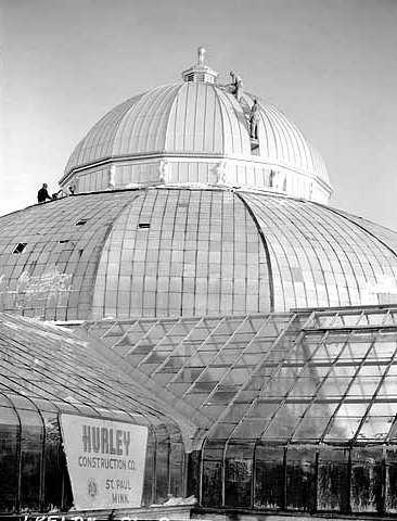 Black and white photograph of restoration work being done on the Conservatory, ca. 1953.