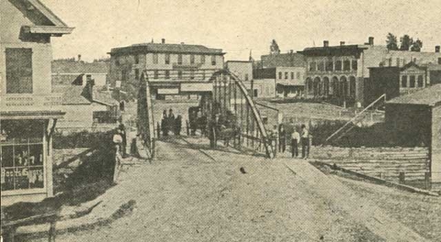 Black and white photograph of Bridge Square, Northfield, 1876.  