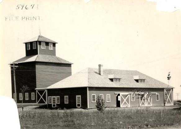 Black and white photograph of the machine shed and elevator on the grounds of the Northwest Experiment Station were built in 1913.