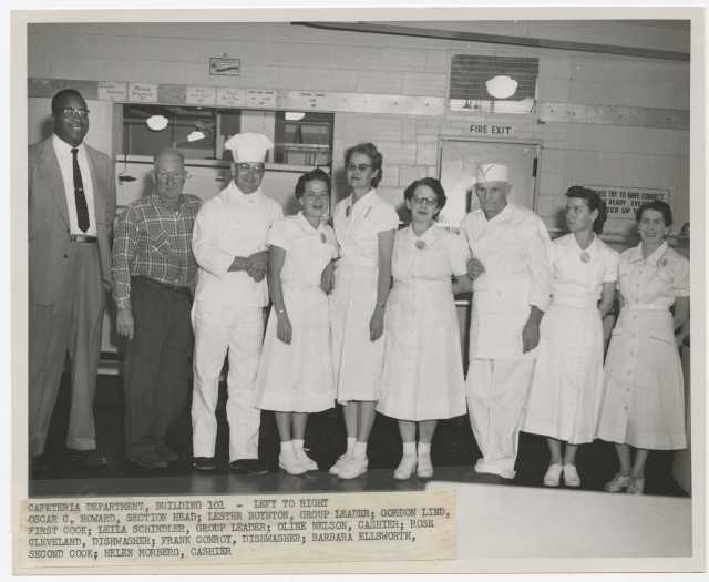 Twin Cities Arsenal cafeteria section head Oscar C. Howard and cafeteria employees, 1957. Industrial Relations Photographs, Twin Cities Army Ammunition Plant files, box 143.E.17.2F.,  Manuscripts Collection, Minnesota Historical Society.