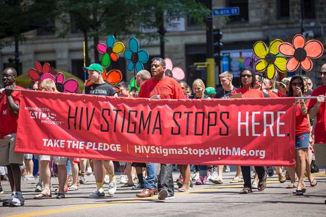 Minnesota AIDS Project volunteers marching in the 2013 Pride Parade
