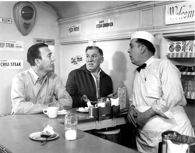Reid Ray Film Industries films a scene for the movie <em> Cash on the Barrelhead</em> inside Mickey's Diner. Actor William Bendix is at center.