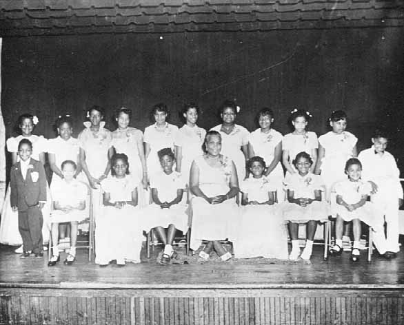 Black and white photograph of a children’s piano recital at Phyllis Wheatley Settlement House, Minneapolis, ca. 1953. 