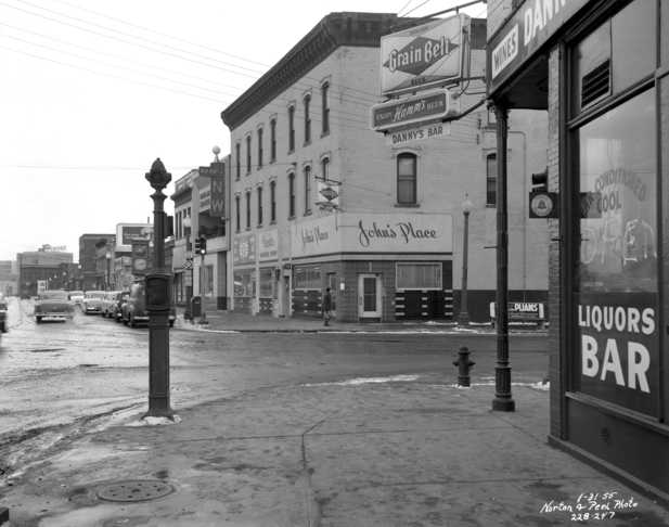 Black and white photograph of the intersection of Washington Avenue and Plymouth Avenue North in North Minneapolis, January 31, 1955.