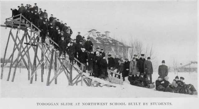 Black and white photograph of a toboggan slide built at the NSWA by students, December 13, 1916. Printed in the school’s 1916 yearbook.
