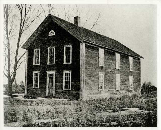 Black and white photograph of St. Ansgar's Academy, predecessor of Gustavus Adolphus College, located in East Union, Carver County from 1863–1876.