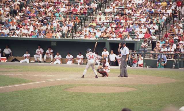 Color image of Kirby Puckett batting against the Baltimore Orioles during a game at Camden Yards.