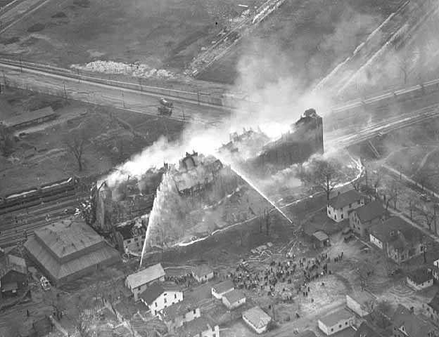 Black and white aerial image of a fire in the University District in 1938.