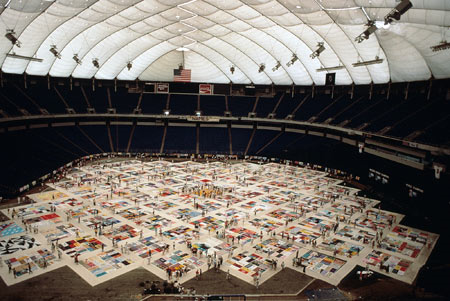 Color image of the NAMES Project AIDS Memorial Quilt at the Metrodome, 1988.