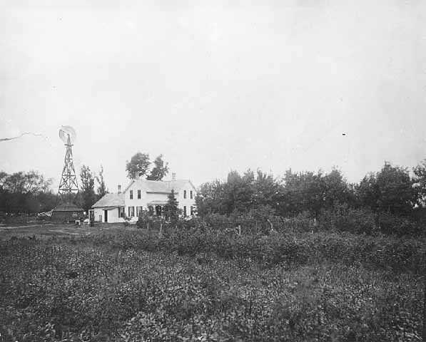 Black and white photograph of a Minnesota farm house, ca. 1890.