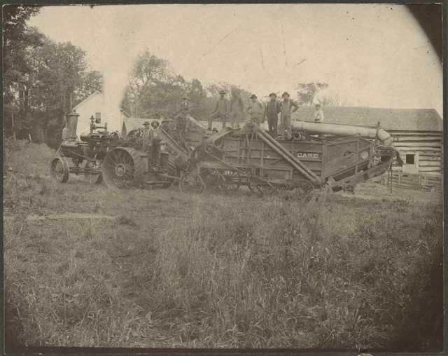 Photograph of farmers and threshing machine, ca. 1900