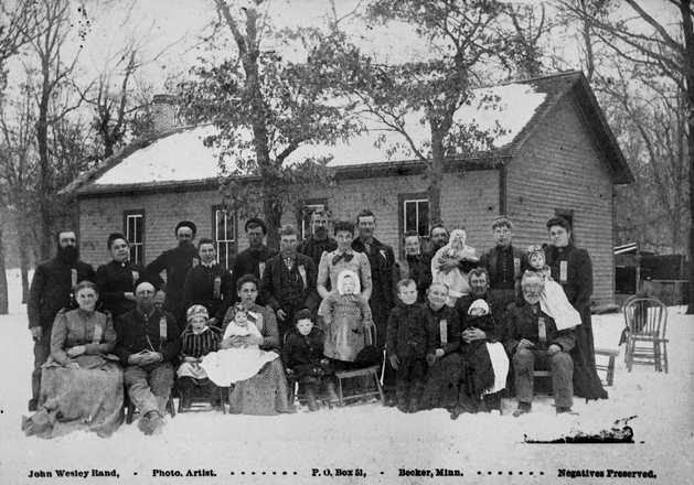 Black and white photograph of Crescent Grange Hall and members, Linwood Township, Anoka County, 1880.