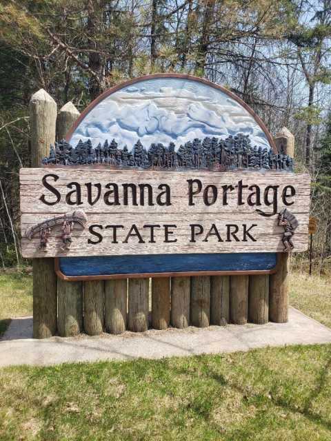Entrance sign at Savanna Portage State Park acknowledging the area’s Indigenous and fur-trading history, 2018. Photograph by Jon Lurie; used with the permission of Jon Lurie.