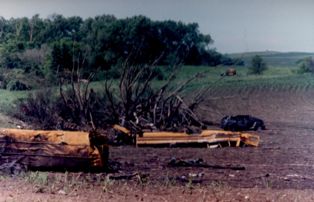 The remains of two school buses in a field after Chandler–Lake Wilson Tornado, June 1992.