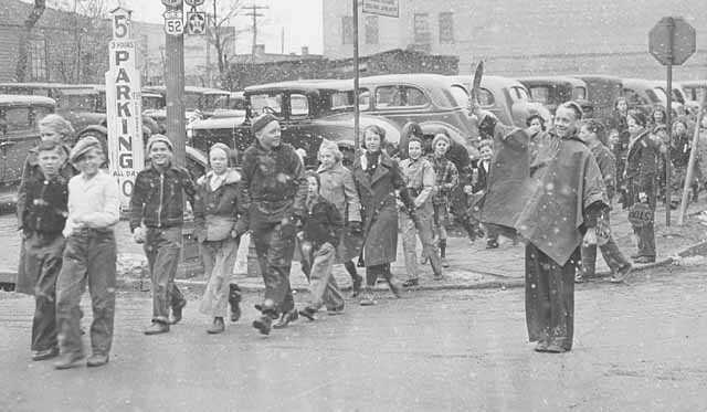 The children of Franklin School being escorted across the street by school police, St. Paul.
