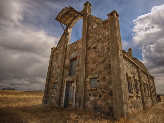 Color image of the front side of the exterior of Schott Barn. Photographed on April 14, 2014, by Craig Voth.