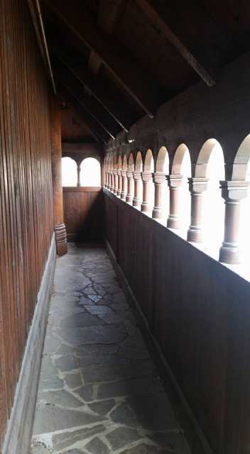 Color image of the Hopperstad Stave Church replica’s exterior walkway, called a svalgang in Norwegian, April 2, 2017. Photographed by Kaci Johnson.