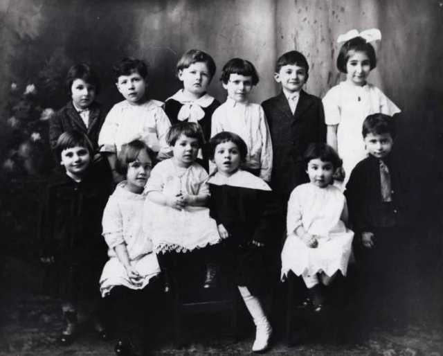 Black and white photograph of children attending a child's birthday party c.1912. 