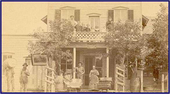1878 Photograph showing the Helvetia General Store as well as members of the owner's family and other community members