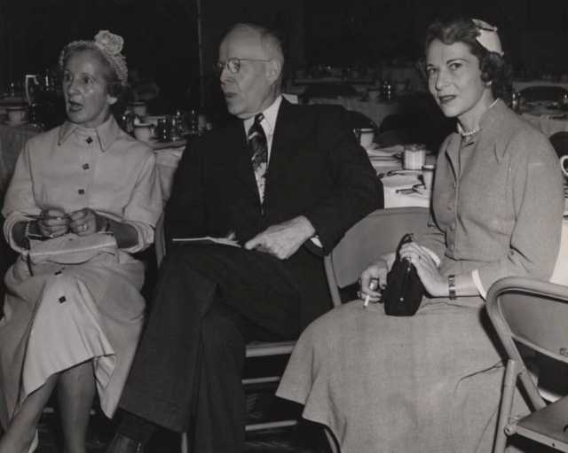 Black and white photograph of Ruth Melamond, Dr. Owen Wangensteen, and Luella Maslon at a Mount Sinai Women's Auxiliary function, 1952.