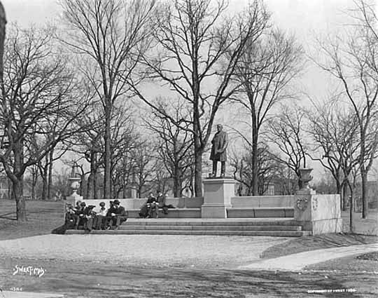 Statue of John S. Pillsbury; students on attached bench