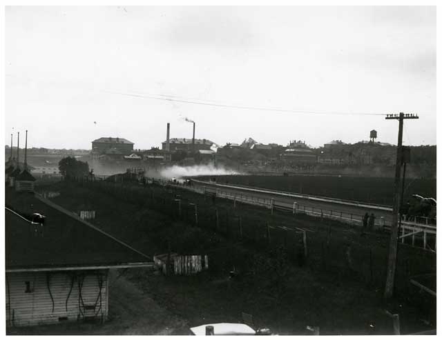 Black and white photograph of a auto race at the 1917 Minnesota State Fair. 