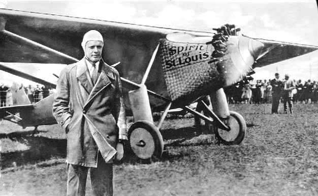 Black and white photograph of Charles Augustus Lindbergh with the "Spirit of St. Louis," c.1927.