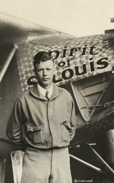 Black and white photograph of Charles Augustus Lindbergh with the "Spirit of St. Louis," c.1928.