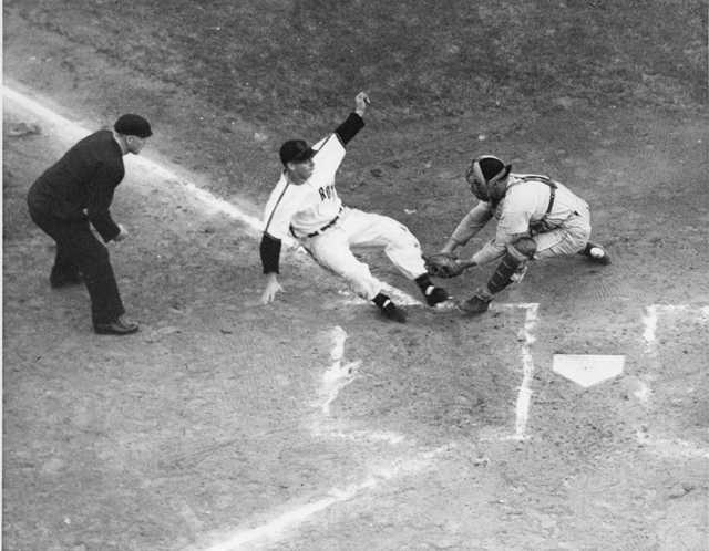 A Rox player slides home in an exciting play captured by St. Cloud Times photographer Myron Hall, c.1949. From the Myron Hall Collection, Stearns History Museum and Research Center, St. Cloud.