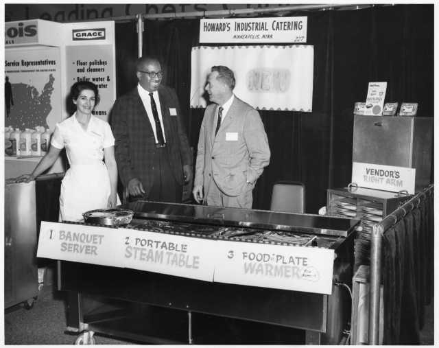 Restaurant trade-show booth for Howard’s Industrial Catering displaying patented heated food carriers, ca. 1960s. Photo by H. M. Schwang Photo Company. Oscar C. Howard papers, 1945–1990, Cafeteria and Industrial Catering Business, Manuscripts Collection, Minnesota Historical Society.