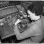 Woman operating a drill press