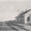 Black and white postcard showing the Great Northern Railway Depot and a grain elevator behind the depot in Clontarf, c.1880s.