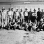 Black and white photograph of German prisoners of war outside a farm building in Moorhead, ca. 1943–1945. Used with the permission of the Historical and Cultural Society of Clay County. 