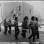 Brown Berets marching with flags