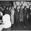 The Wheatley Aires, a men’s singing group, sing in front of an audience at Phyllis Wheatley Community Center (809 Aldrich Avenue North) with a pianist accompanying. ca. 1950.