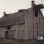 Color image of Schott Barn with its roof intact, c.1985.