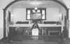 Black and white photograph of Rev. Alphonse Reff standing in the pulpit at St. Mark’s African Methodist Episcopal Church, Duluth, July 8, 1975.